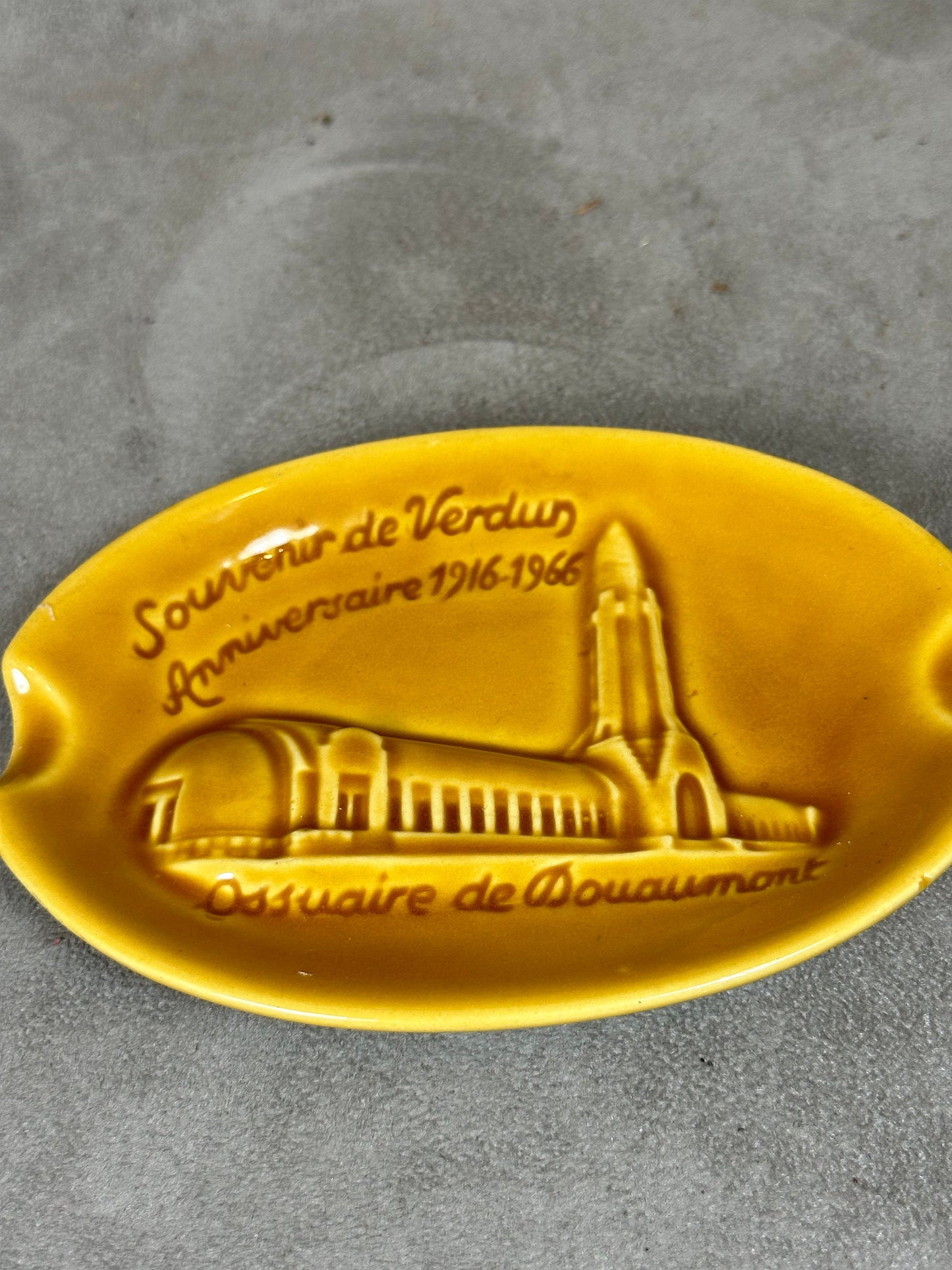 Yellow ceramic ashtray from the Douaumont ossuary Souvenir of Verdun Made in France 1960s