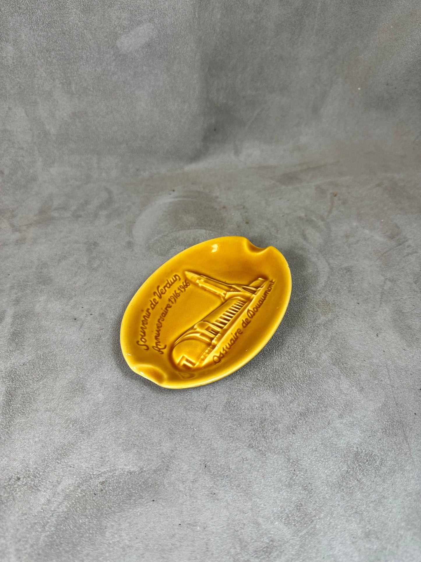 Yellow ceramic ashtray from the Douaumont ossuary Souvenir of Verdun Made in France 1960s