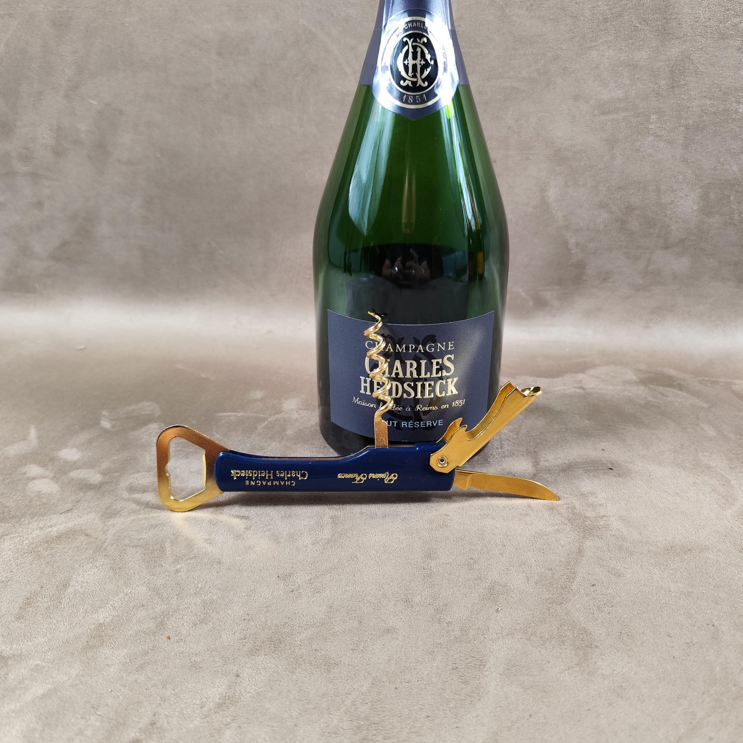 Décapsuleur, Tire-bouchon Champagne Charles Heidsieck en plastique bleu Made in France Vintage 1980