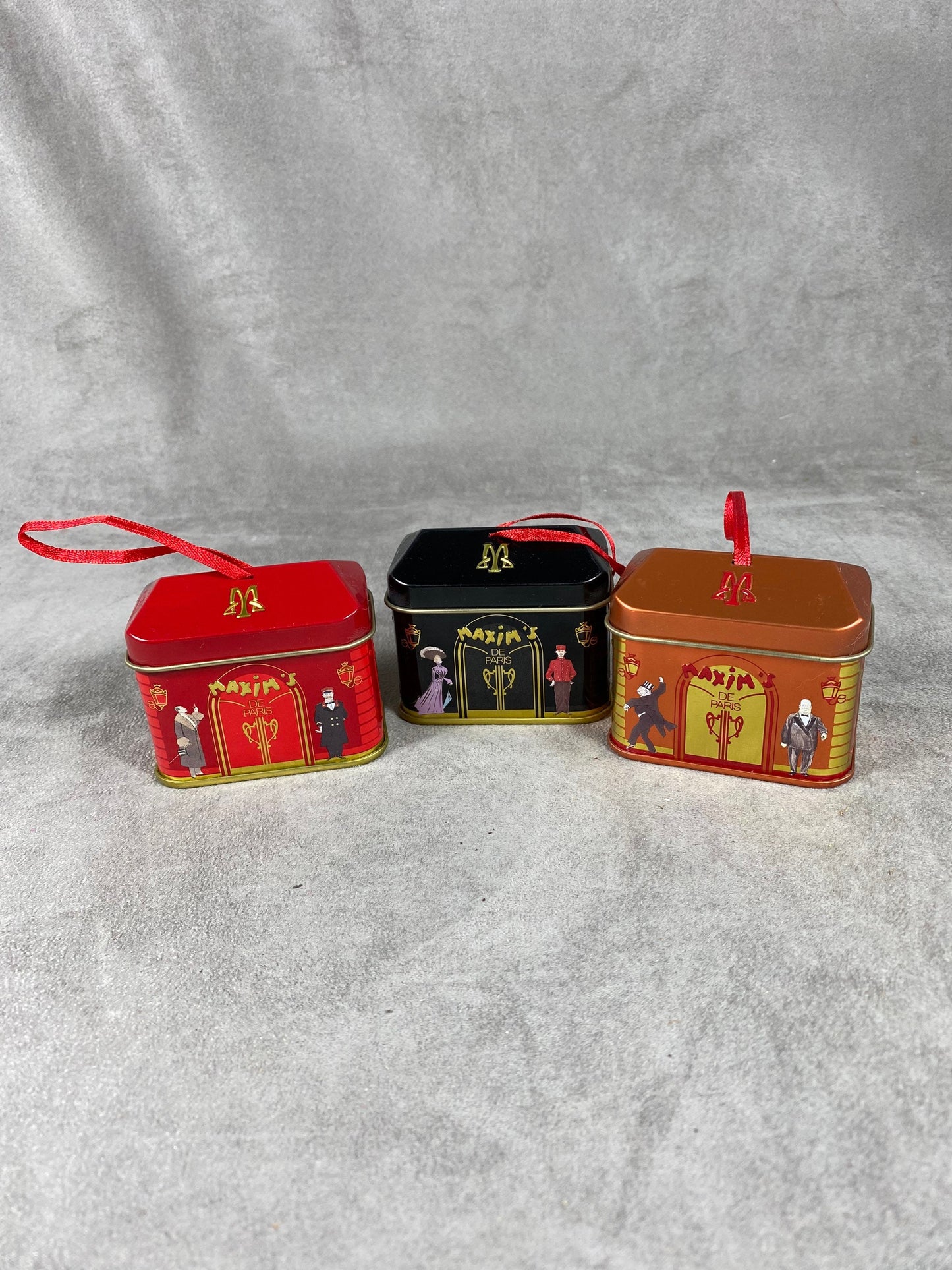 Lot of 3 empty red, black and brown aluminum boxes Maxim's de Paris 1970s