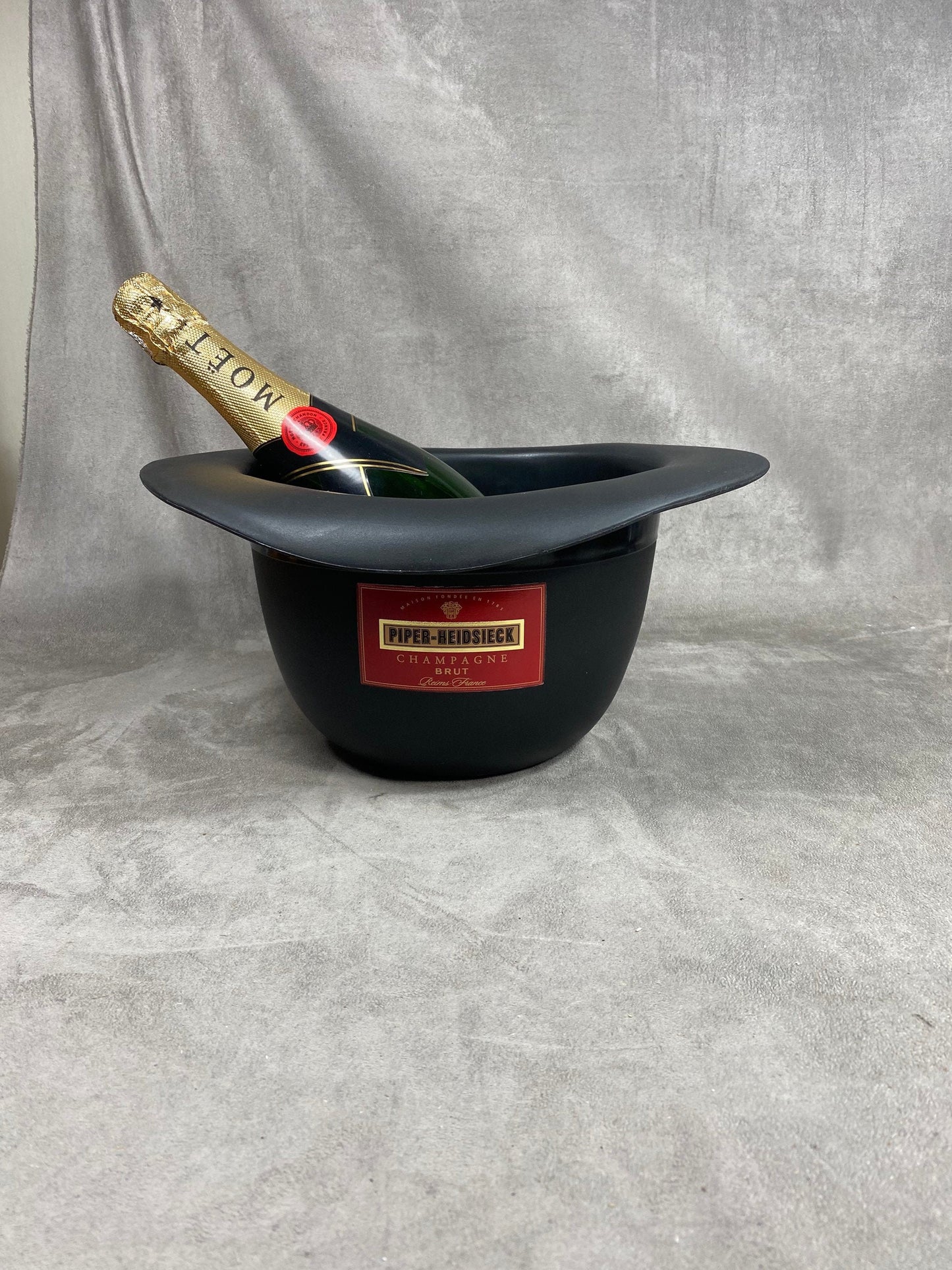 RARE Red and black plastic Piper-Heidsieck Champagne bucket in the shape of a hat from The Avengers collection Bowler hat and leather boots