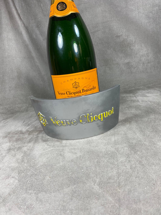 Silver and orange plastic Jeroboam Veuve Clicquot champagne bottle cover