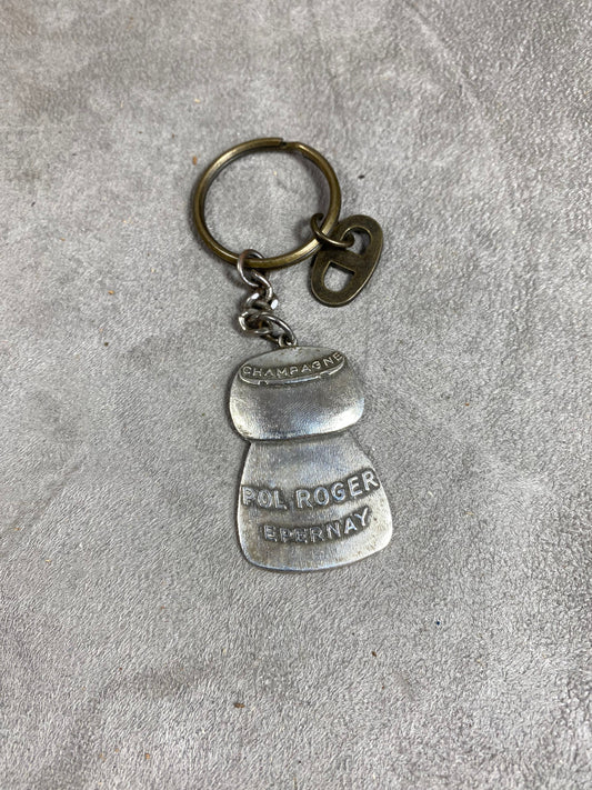 Porte clés Pol Roger en métal argenté en forme de bouchon de champagne Made in France Années 1980