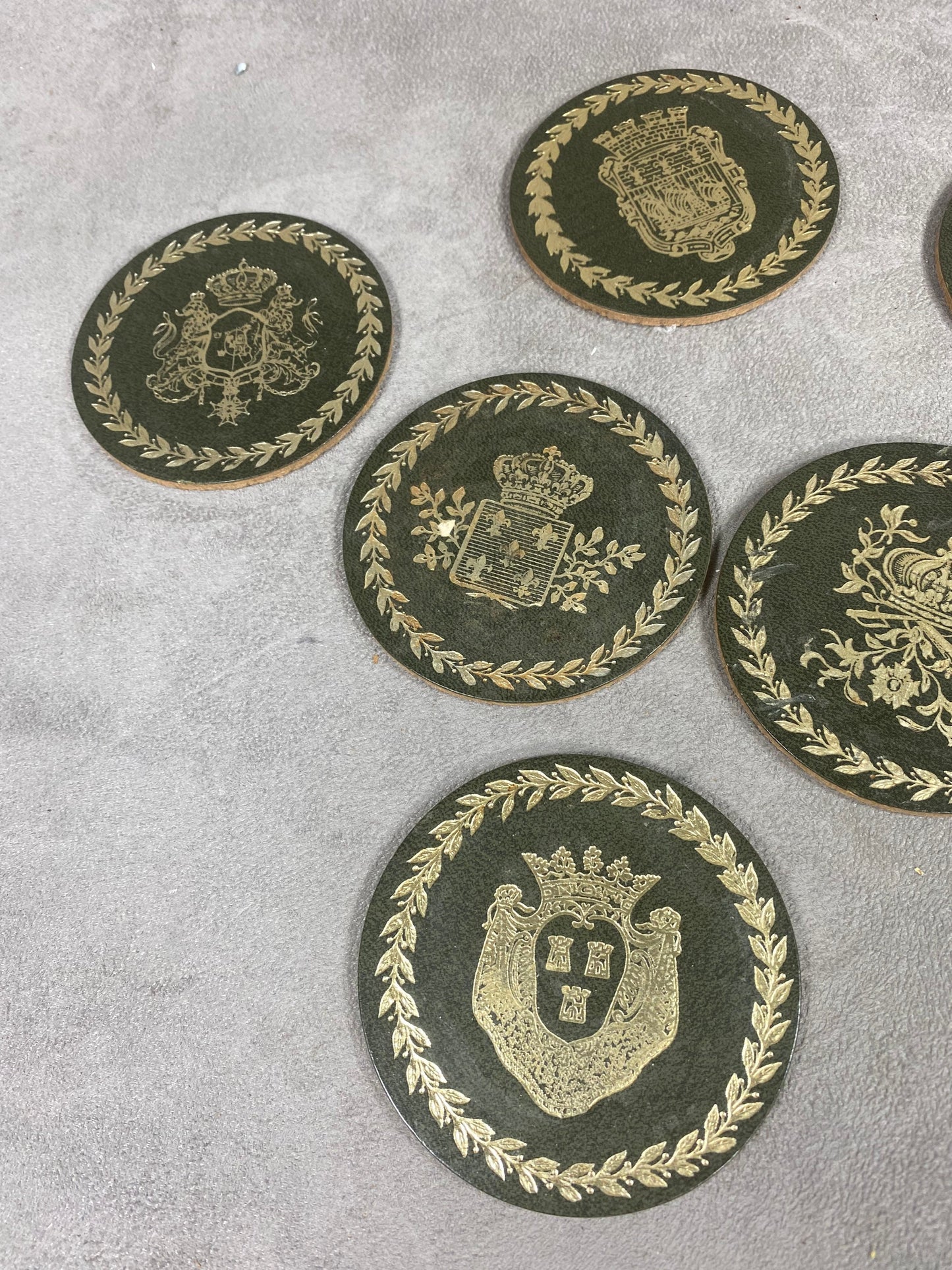 Set of 8 coasters decorated with the coats of arms of the Swedish royal families in cork Made in Sweden Circa 1980