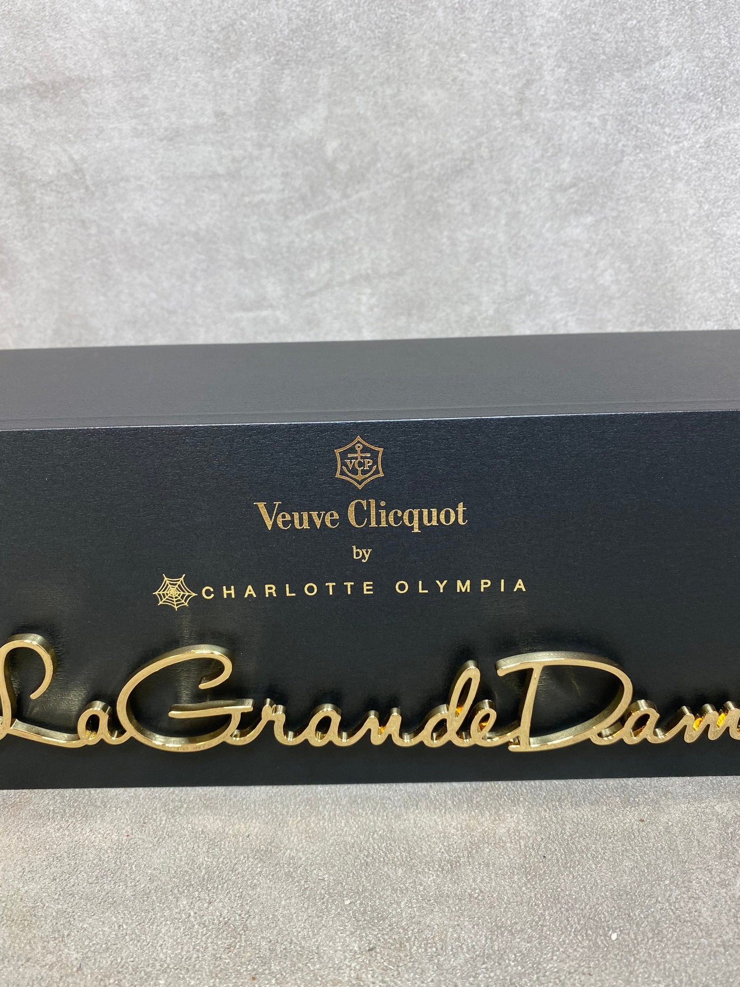 VERY RARE Veuve Clicquot black bottle holder in wood and gold metal La Grande Dame Clicquot by Charlotte Olympia 1990s