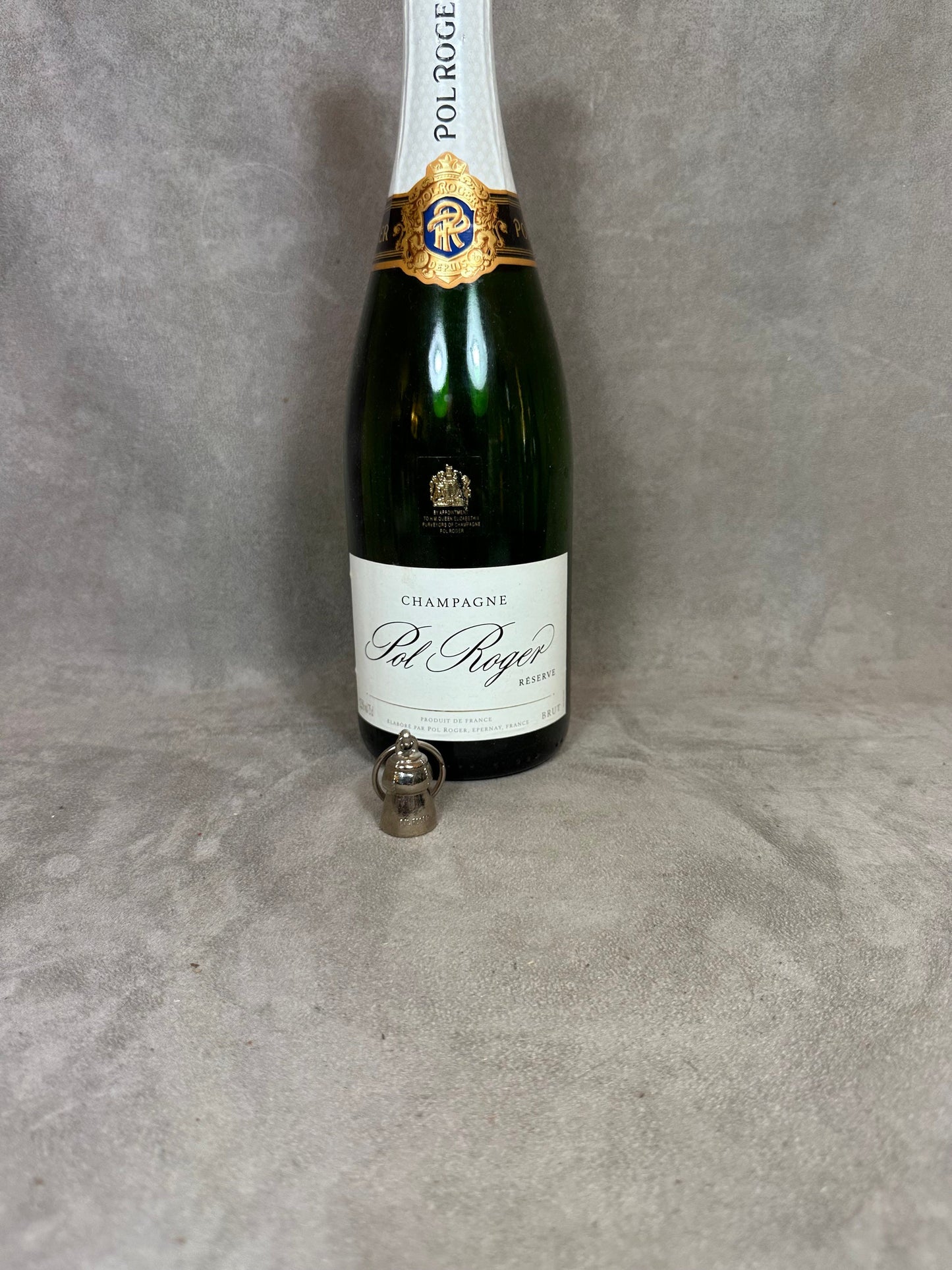 Porte clés Pol Roger en métal argenté en forme de bouchon de champagne Made in France Années 1980