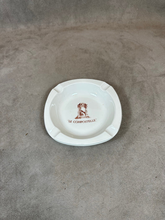 Cendrier publicitaire du restaurant Le Compostelle vintage en faience PILLIVUYT Made in France