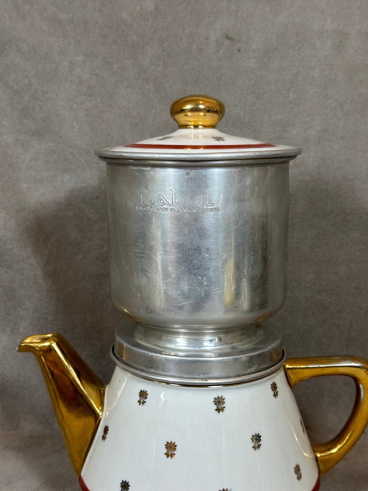 RARE Salam silver filter coffee maker on vintage red and white earthenware with gold details from the 1960s