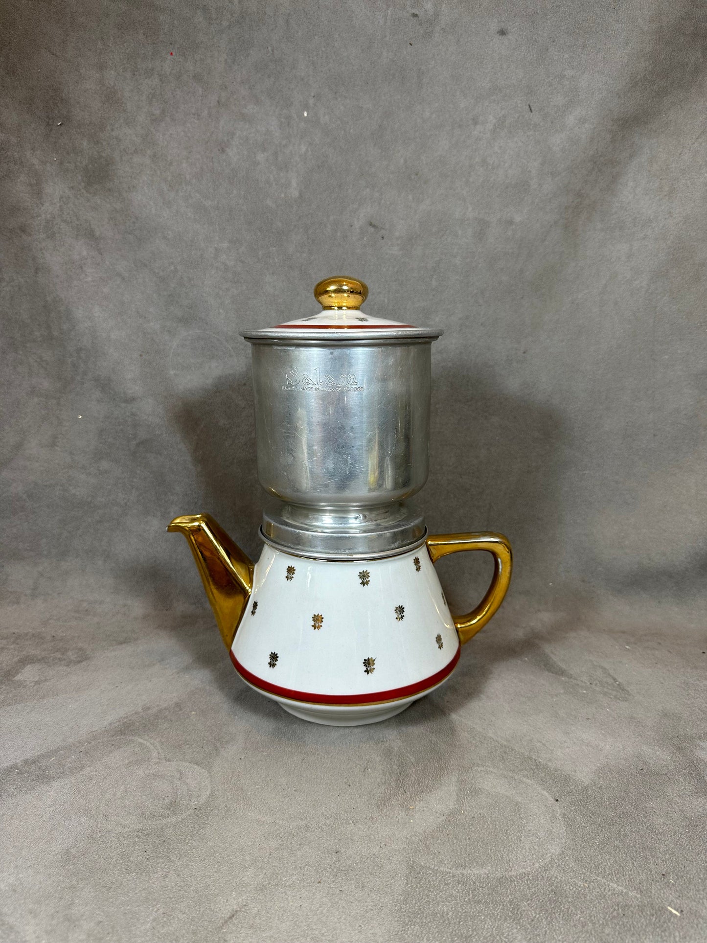 RARE Salam silver filter coffee maker on vintage red and white earthenware with gold details from the 1960s