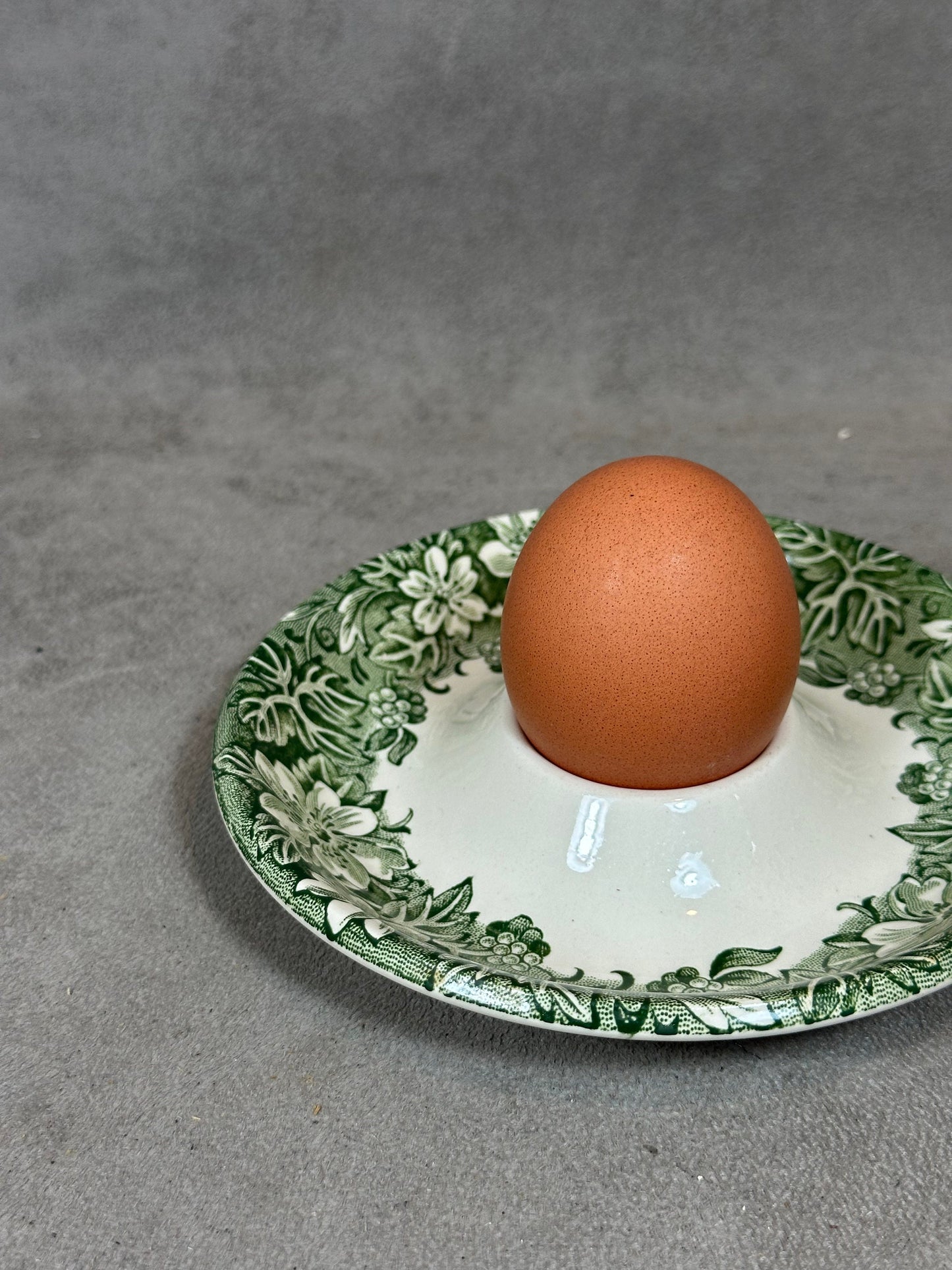 Antique earthenware egg cup with foliage decoration from the 1960s