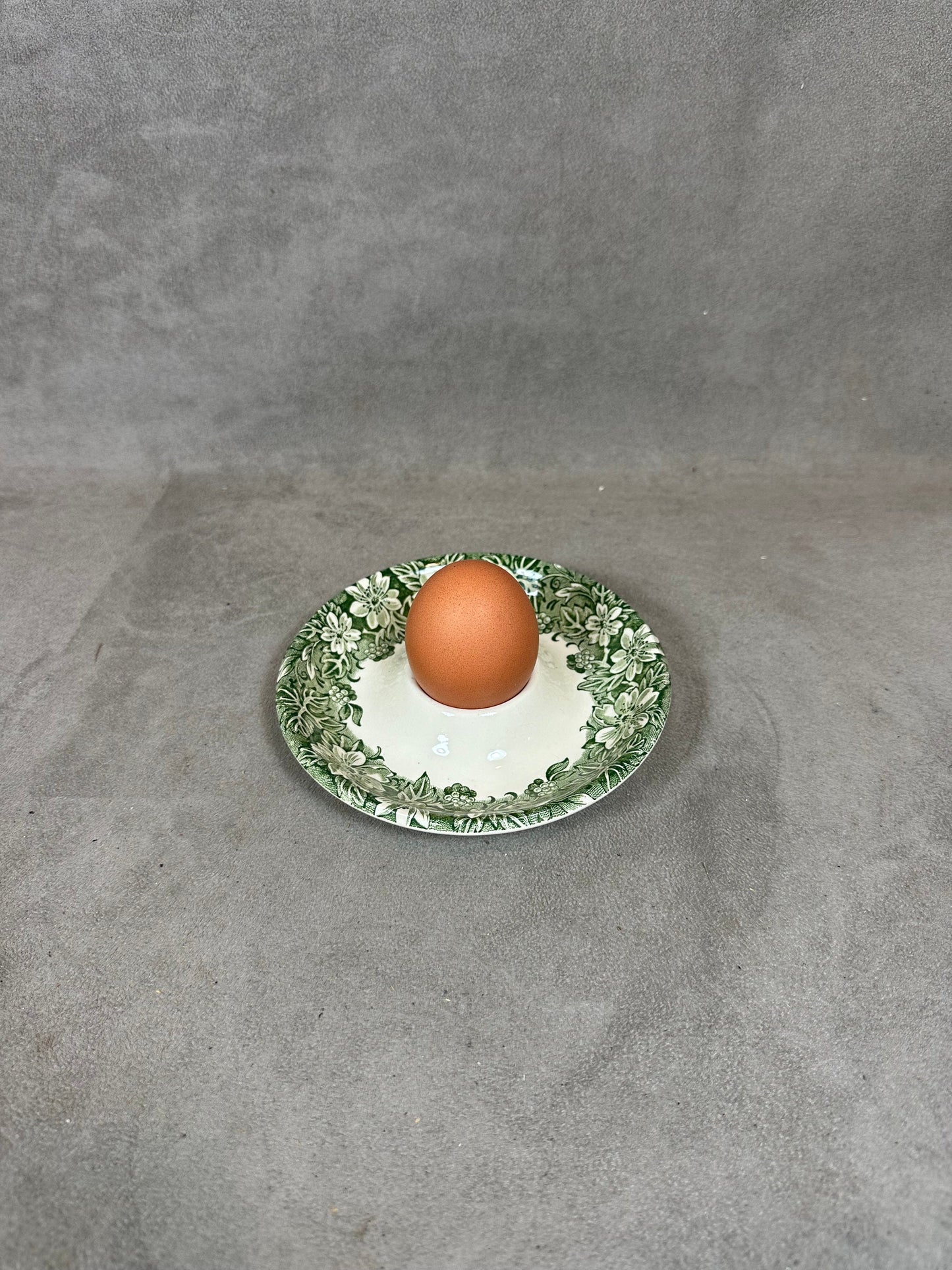Antique earthenware egg cup with foliage decoration from the 1960s