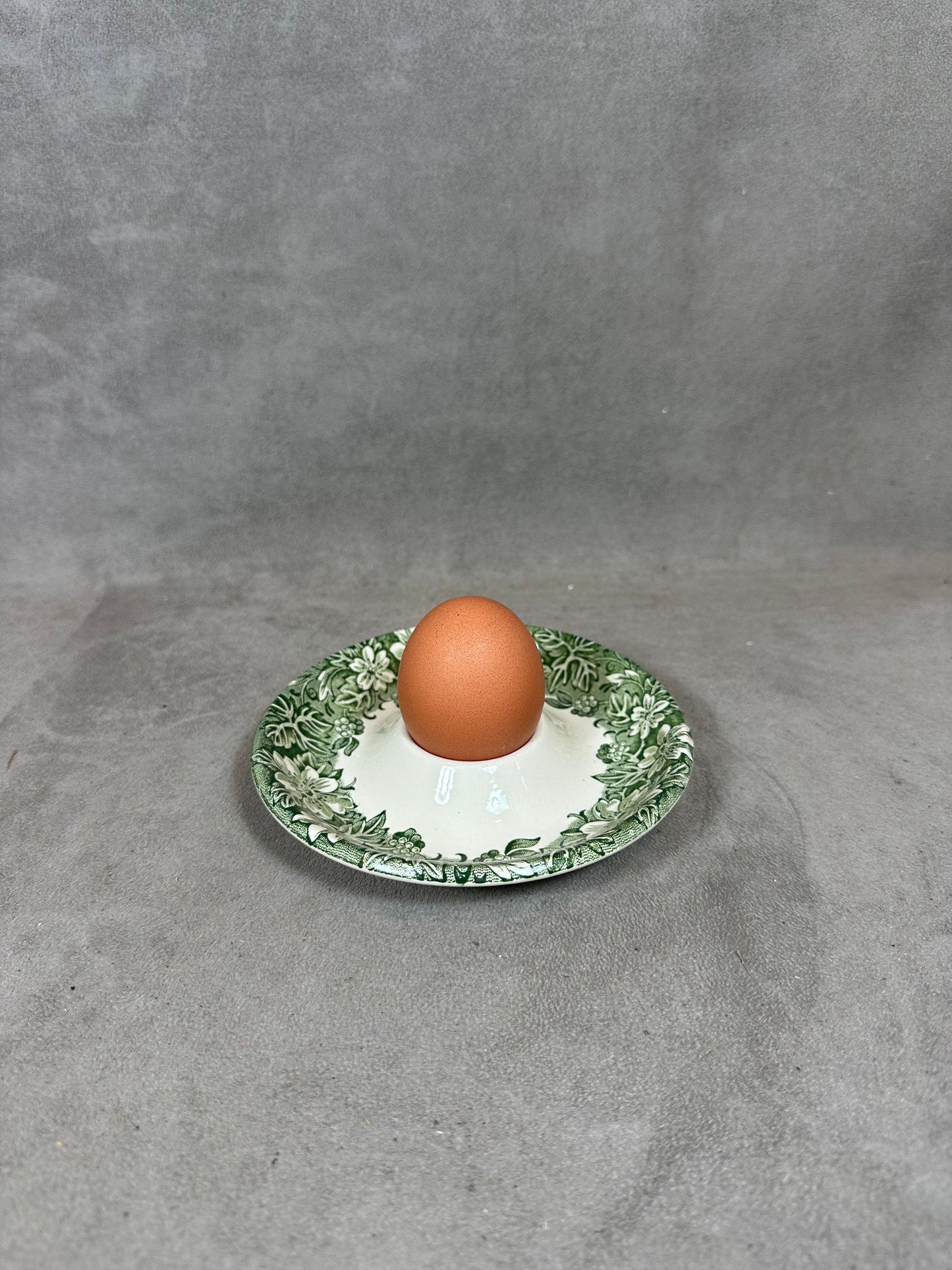 Antique earthenware egg cup with foliage decoration from the 1960s