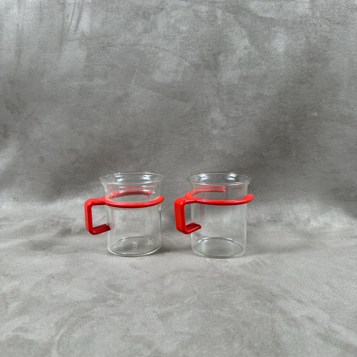 Set of 2 BODUM glass cups with red plastic rim Made in France 1990