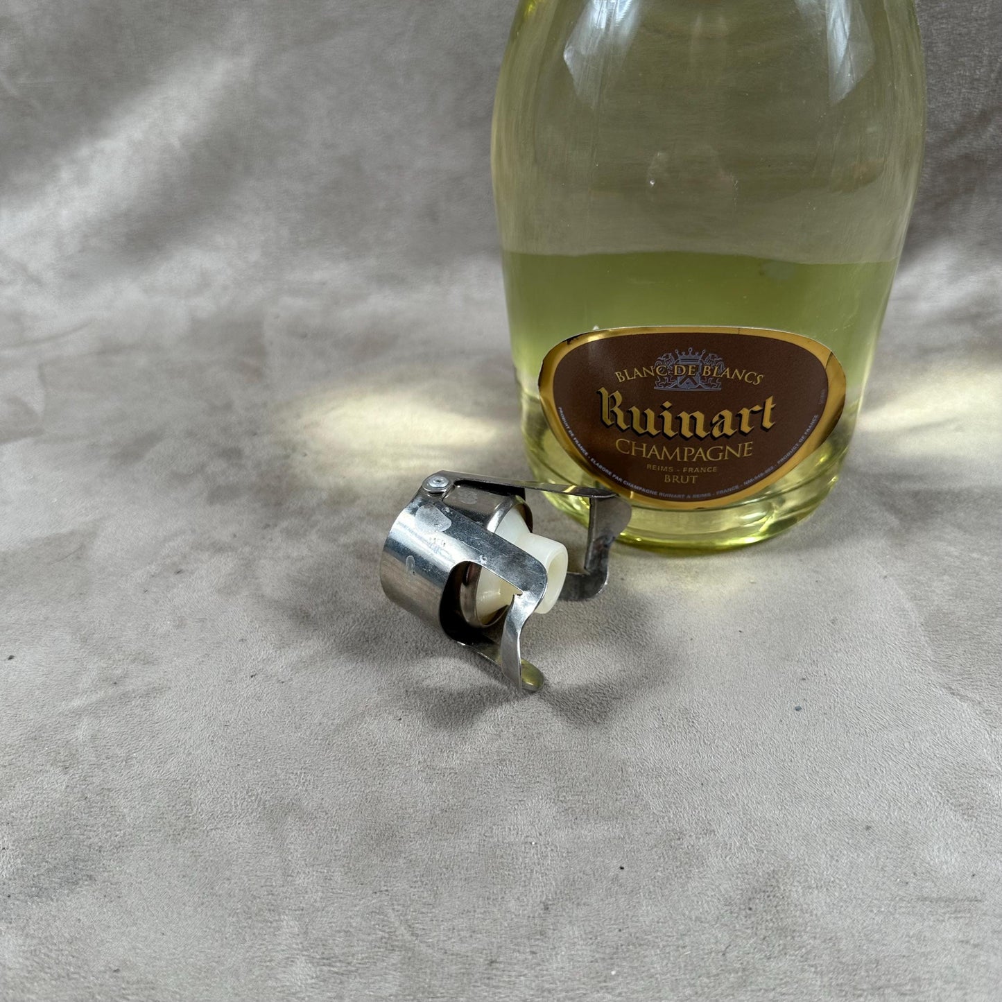 Ruinart Champagne metal stopper for opened champagne bottles