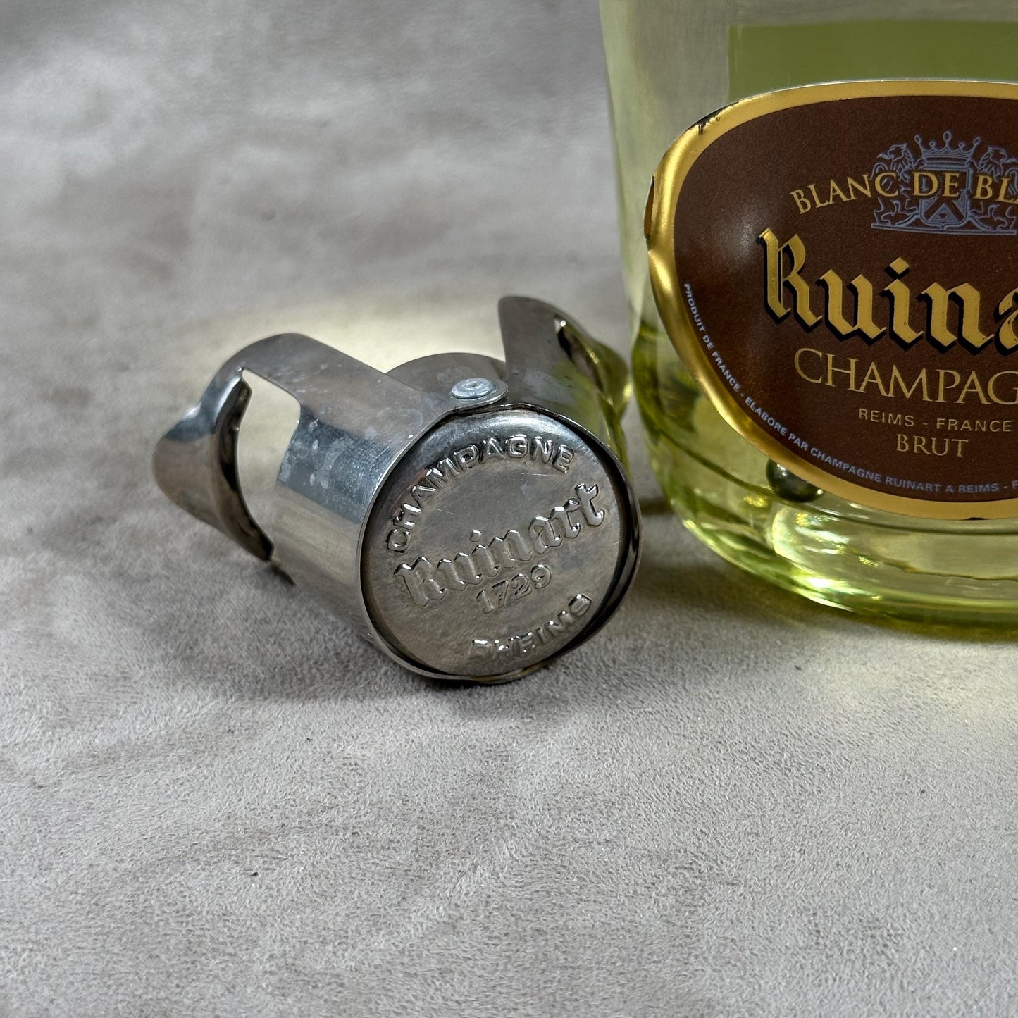 Ruinart Champagne metal stopper for opened champagne bottles