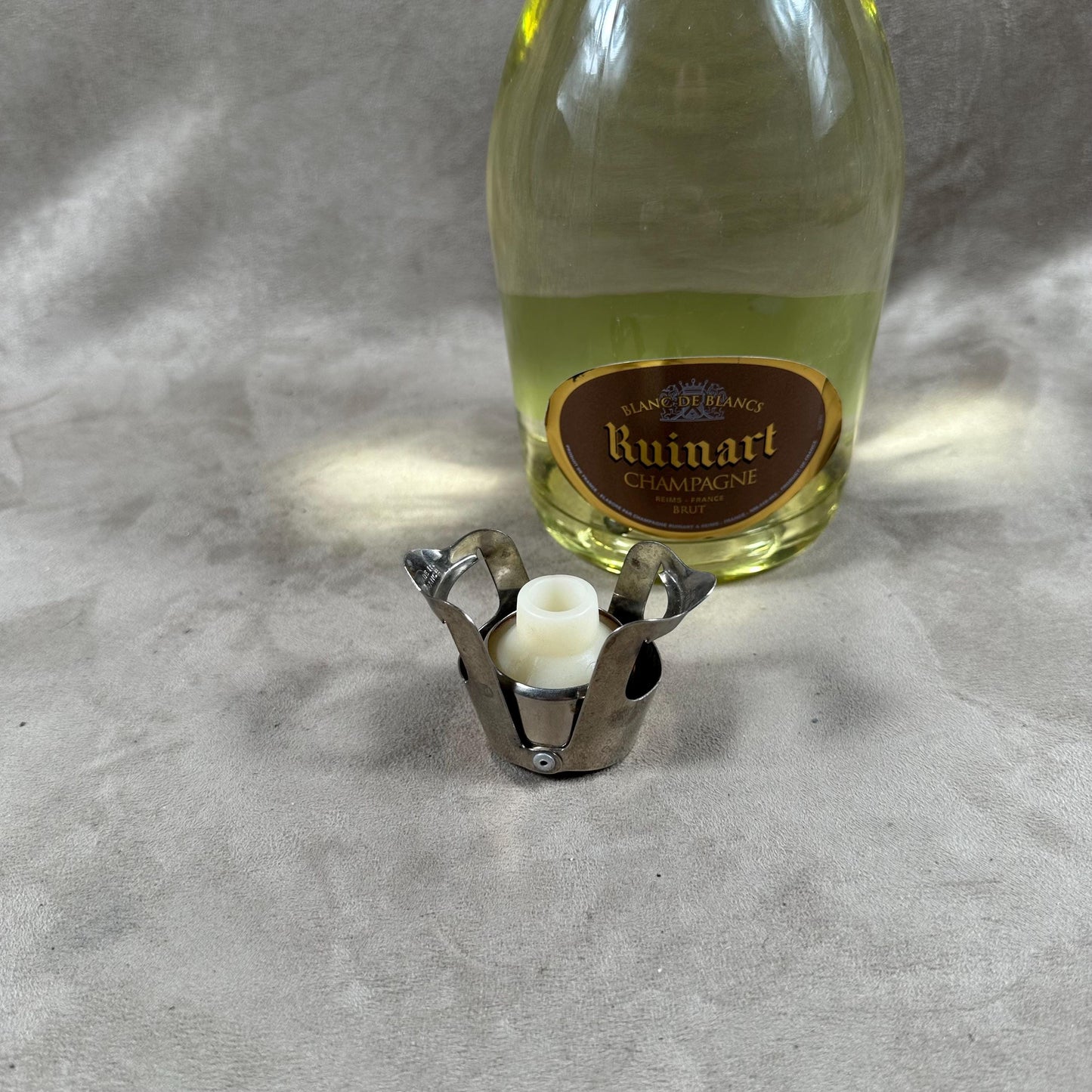 Ruinart Champagne metal stopper for opened champagne bottles