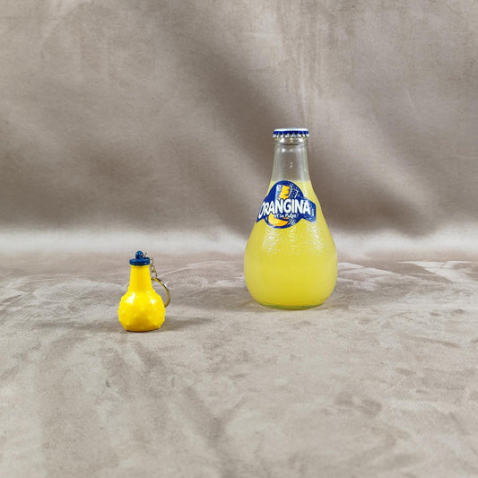 Porte clés Publicitaire en forme de bouteille Orangina en plastique Made in France Vintage 1980