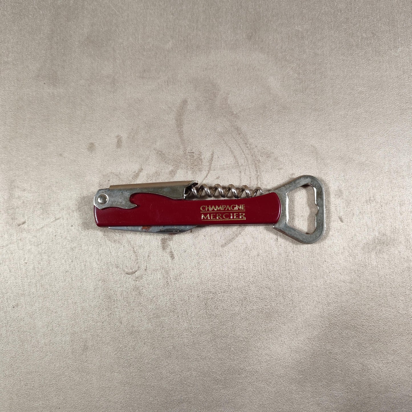Décapsuleur, Tire-bouchon Champagne Mercier en acier et plastique rouge Made in France Vintage 1970