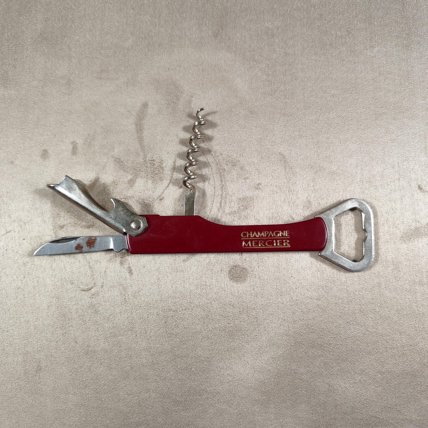 Décapsuleur, Tire-bouchon Champagne Mercier en acier et plastique rouge Made in France Vintage 1970
