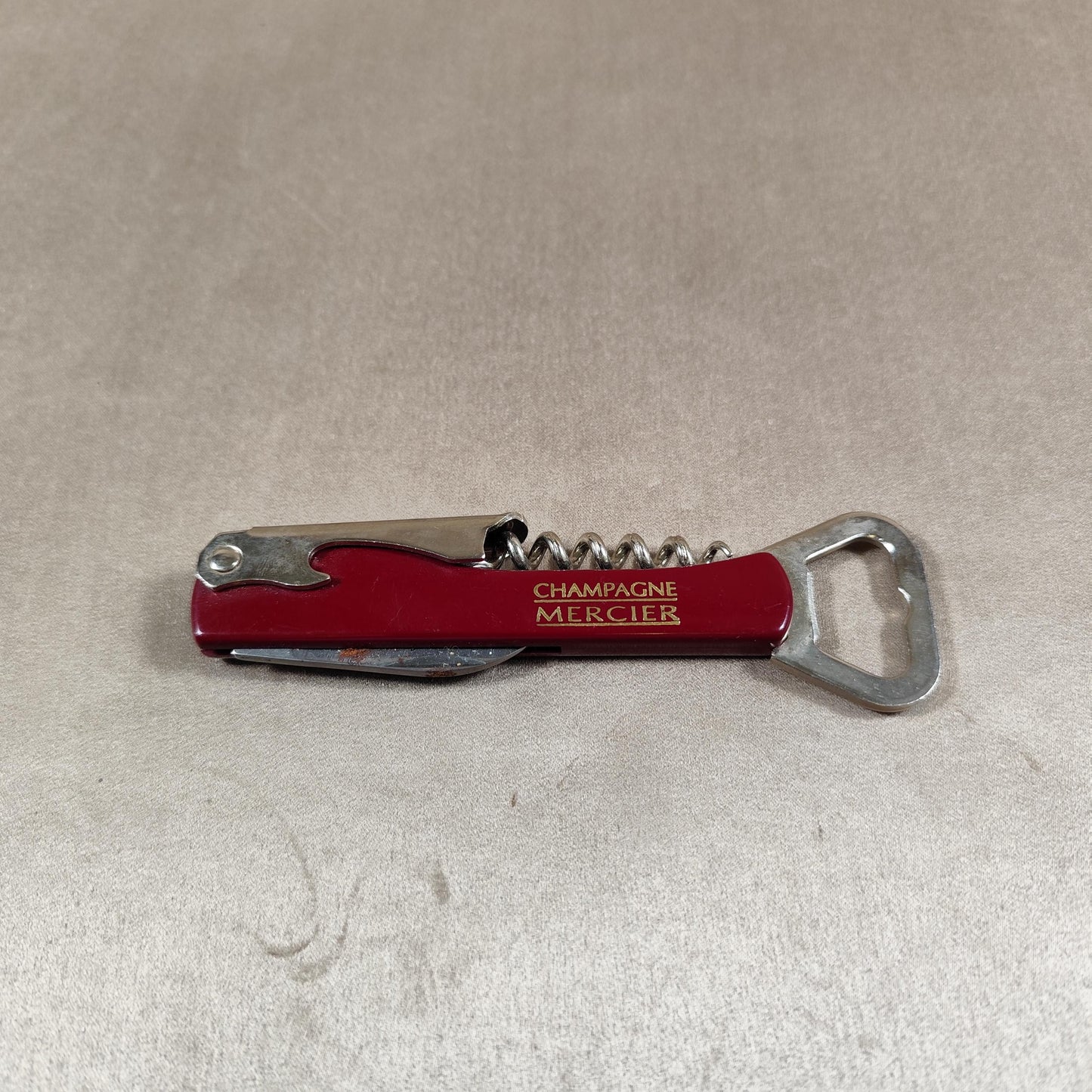 Décapsuleur, Tire-bouchon Champagne Mercier en acier et plastique rouge Made in France Vintage 1970