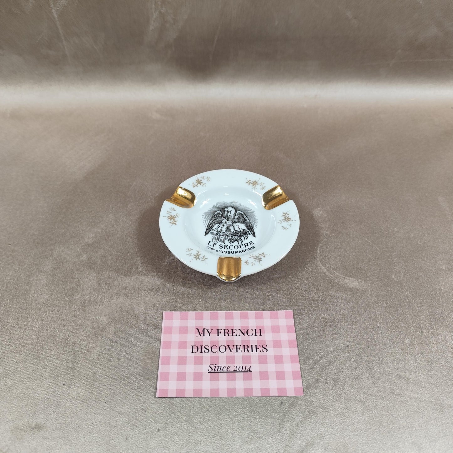 Cendrier publicitaire Le Secours Cies d'Assurances en porcelaine de Limoges Dorure