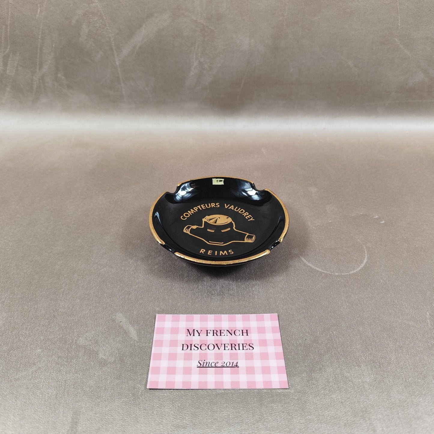 Cendrier publicitaire Compteurs Vaudrey en céramique noire  Reims