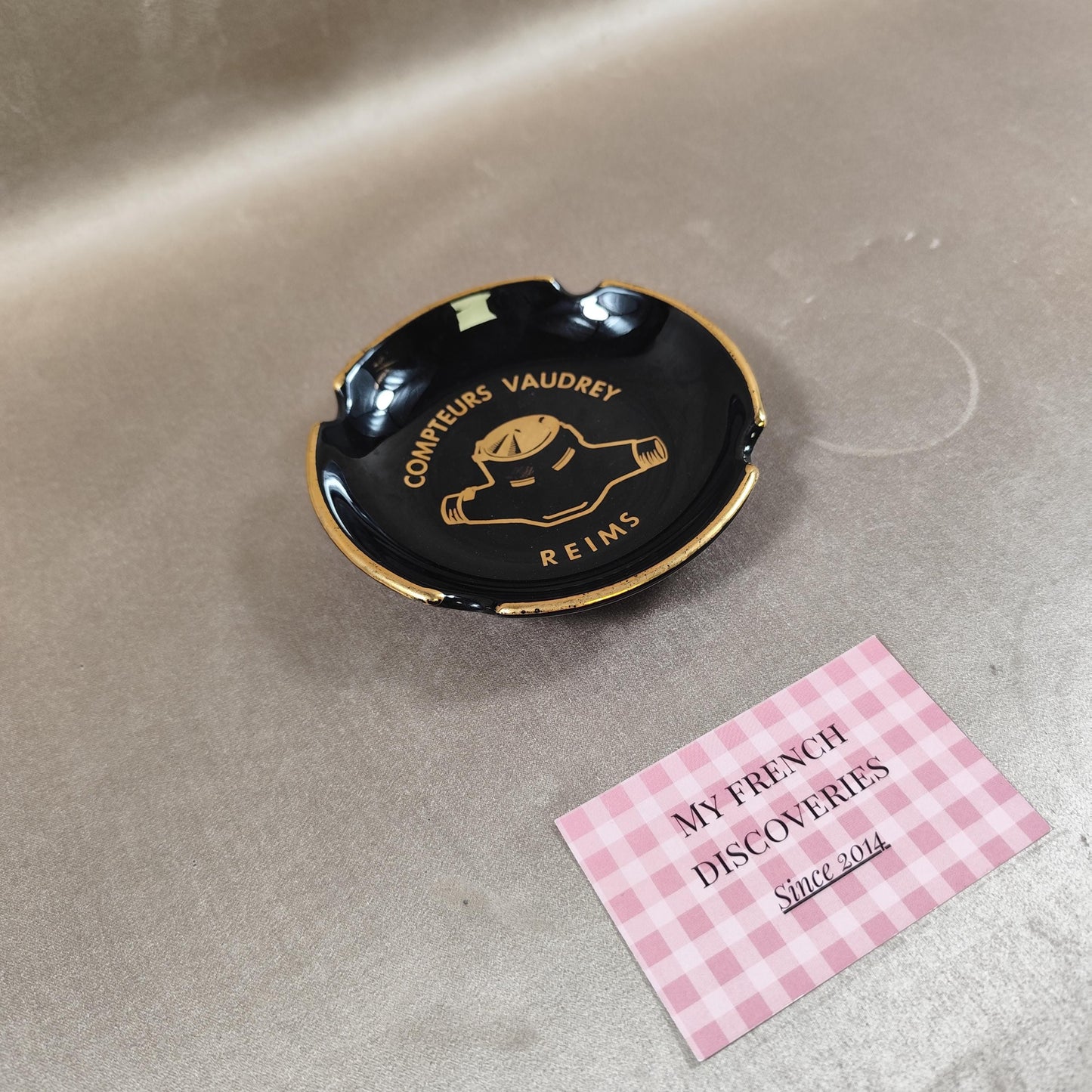 Cendrier publicitaire Compteurs Vaudrey en céramique noire  Reims