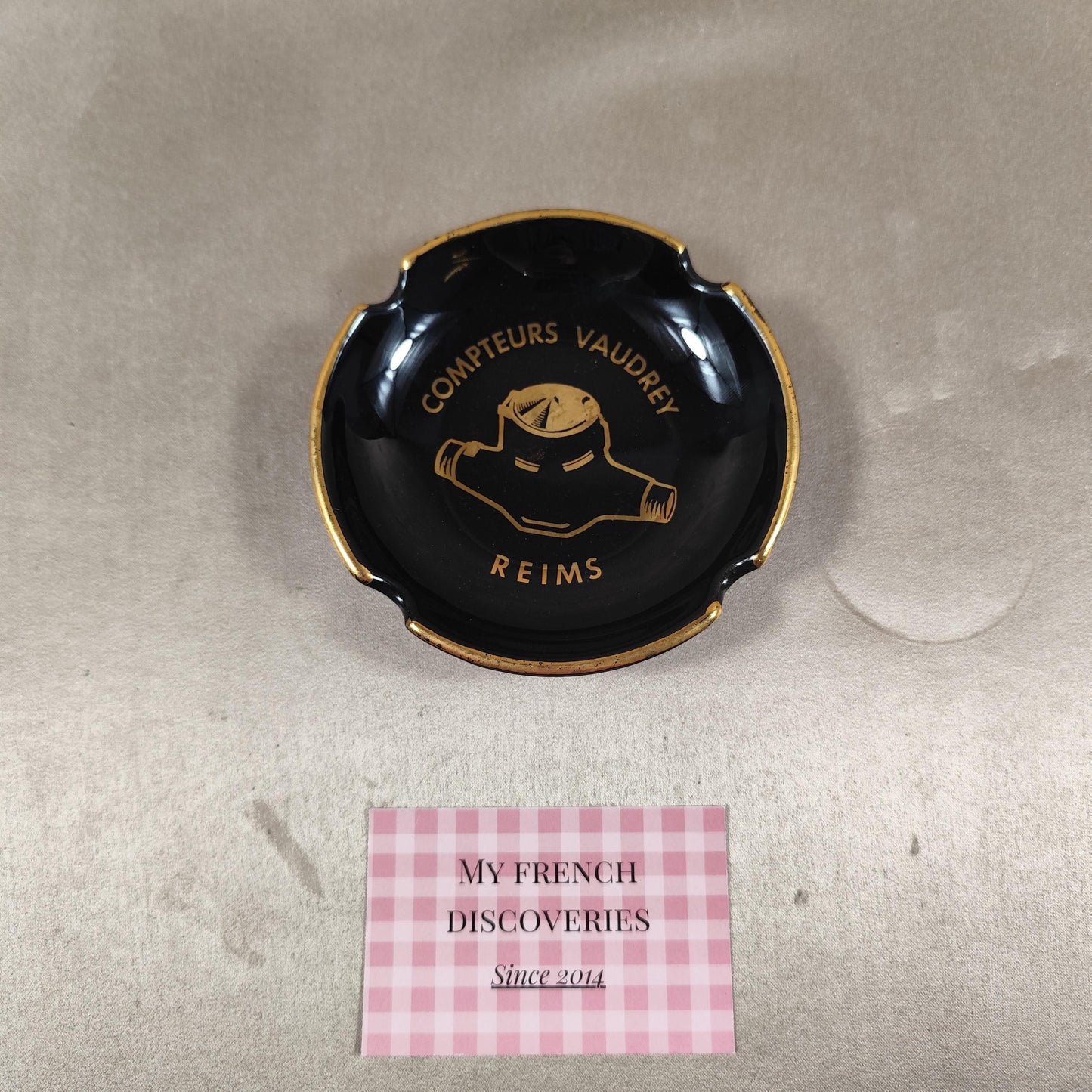 Cendrier publicitaire Compteurs Vaudrey en céramique noire  Reims