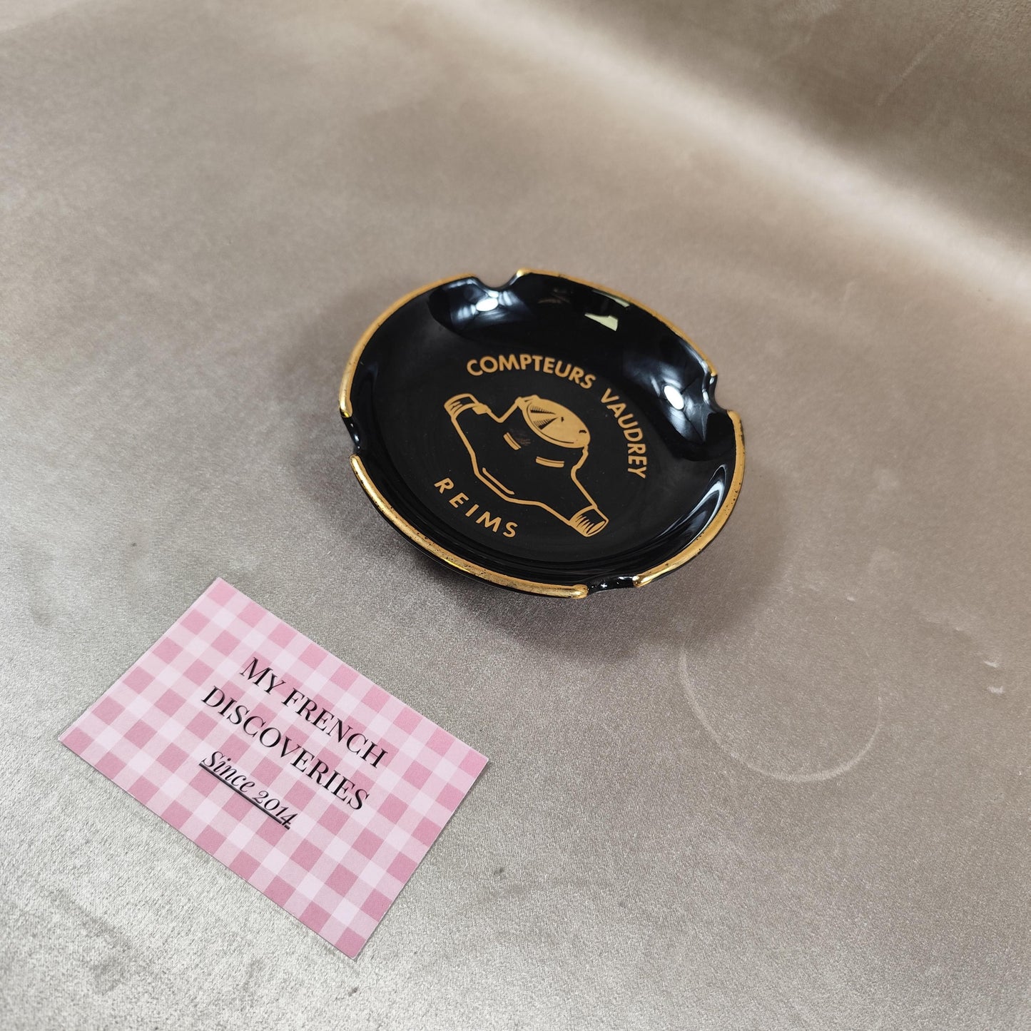 Cendrier publicitaire Compteurs Vaudrey en céramique noire  Reims